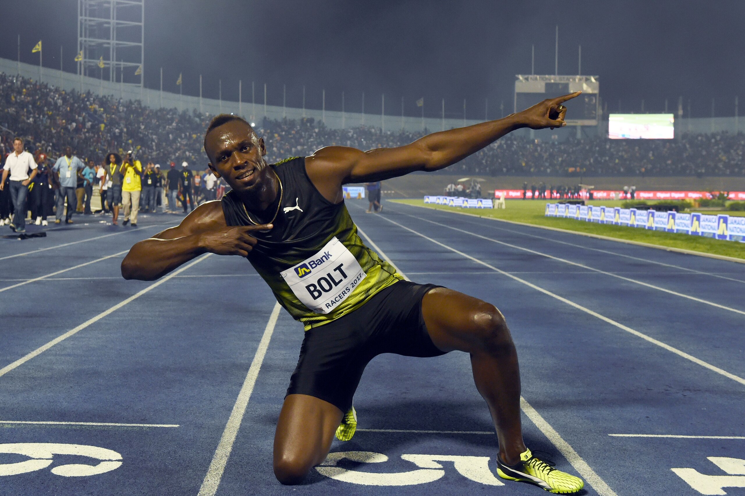 TOPSHOT - Usain Bolt (C) of Jamaica reacts after winning his final race in home country during the Racers Grand Prix at the national stadium in Kingston, Jamaica, on June 10, 2017.
Bolt partied with his devoted fans in an emotional farewell at the National Stadium on June 10 as he ran his final race on Jamaican soil.
Bolt is retiring in August following the London World Championships. / AFP PHOTO / Jewel SAMAD        (Photo credit should read JEWEL SAMAD/AFP/Getty Images)