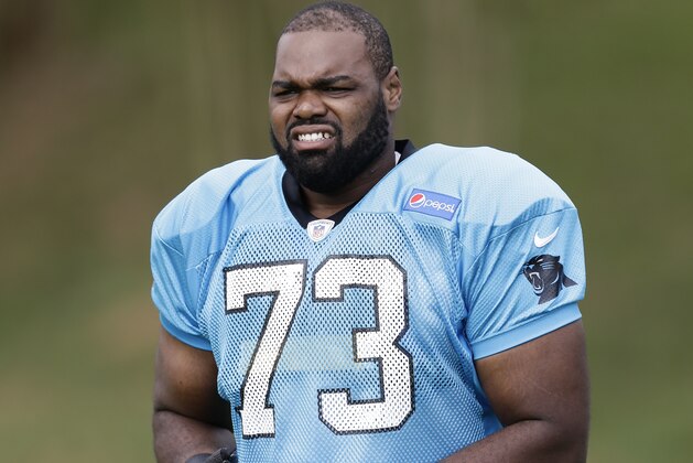 Carolina Panthers tackle Michael Oher (73) takes the field during the NFL football team's training camp in Spartanburg, S.C., Saturday, July 30, 2016. (AP Photo/Gerry Broome)
