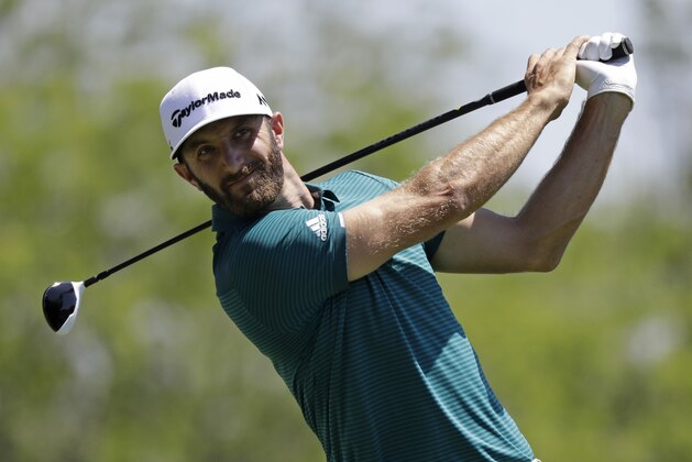 Dustin Johnson tees off on the fifth hole during the second round of the Memorial golf tournament, Friday, June 2, 2017, in Dublin, Ohio. (AP Photo/Darron Cummings)