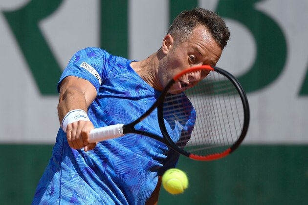 Germany's Philipp Kohlschreiber returns the ball to Australia's Nick Kyrgios during their tennis match at the Roland Garros 2017 French Open on May 30, 2017 in Paris.  / AFP PHOTO / Lionel BONAVENTURE        (Photo credit should read LIONEL BONAVENTURE/AFP/Getty Images)