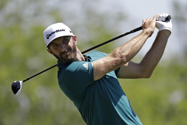 Dustin Johnson tees off on the fifth hole during the second round of the Memorial golf tournament, Friday, June 2, 2017, in Dublin, Ohio. (AP Photo/Darron Cummings)