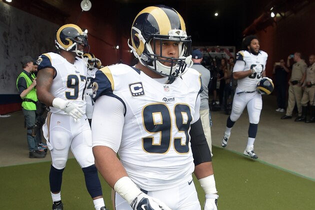 Los Angeles Rams defensive tackle Aaron Donald (99) heads for the field before a game against the Atlanta Falcons played at the Los Angeles Memorial Coliseum in Los Angeles on Sunday, December 11, 2016. (AP Photo/John Cordes)