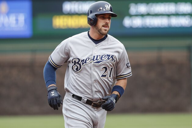 Milwaukee Brewers' Travis Shaw rounds the bases after hitting two-run home run off Chicago Cubs starting pitcher Kyle Hendricks during the first inning of a baseball game, Wednesday, April 19, 2017, in Chicago. Eric Thames scored on a play. (AP Photo/Kamil Krzaczynski)