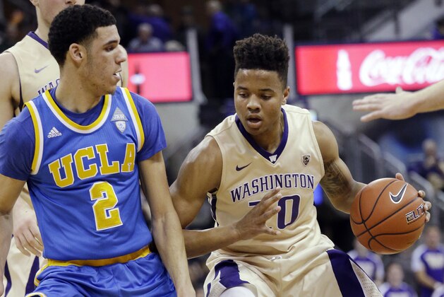 Washington's Markelle Fultz (20) is defended by UCLA's Lonzo Ball during the first half of an NCAA college basketball game Saturday, Feb. 4, 2017, in Seattle. (AP Photo/Elaine Thompson)
