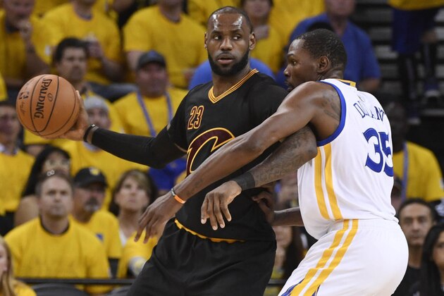 Jun 12, 2017; Oakland, CA, USA; Cleveland Cavaliers forward LeBron James (23) is defended by Golden State Warriors forward Kevin Durant (35) during the third quarter in game five of the 2017 NBA Finals at Oracle Arena. Mandatory Credit: Kyle Terada-USA TODAY Sports