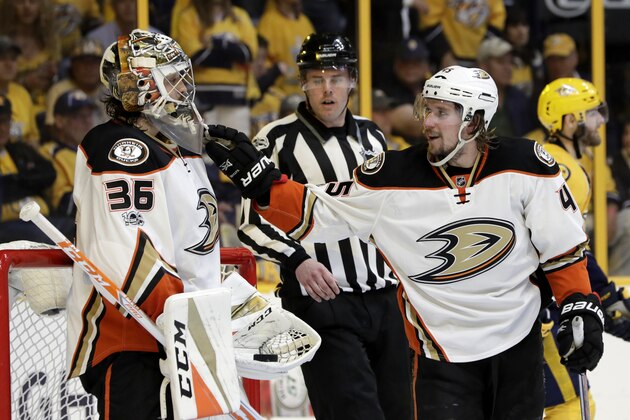 Anaheim Ducks defenseman Sami Vatanen (45), of Finland, congratulates goalie John Gibson (36), in the second period of Game 4 of the Western Conference final against the Nashville Predators, in the NHL hockey Stanley Cup playoffs Thursday, May 18, 2017, in Nashville, Tenn. (AP Photo/Mark Humphrey)