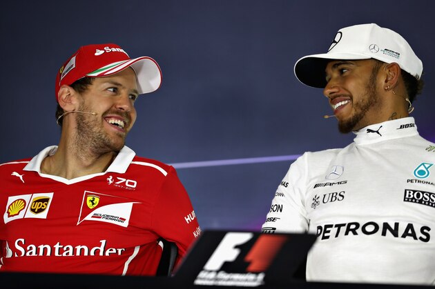 MONTMELO, SPAIN - MAY 14: Sebastian Vettel of Germany driving the (5) Scuderia Ferrari SF70H and Lewis Hamilton of Great Britain and Mercedes GP talk in the post race press conference during the Spanish Formula One Grand Prix at Circuit de Catalunya on May 14, 2017 in Montmelo, Spain.  (Photo by Mark Thompson/Getty Images)