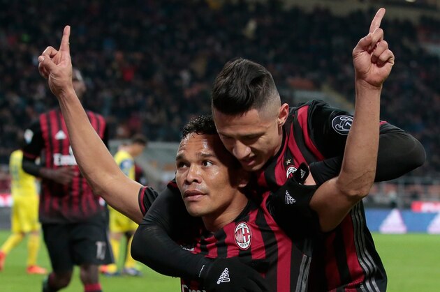 MILAN, ITALY - MARCH 04:  Carlos Bacca of AC Milan (L) celebrates his second goal with his team-mate Gianluca Lapadula during the Serie A match between AC Milan and AC ChievoVerona at Stadio Giuseppe Meazza on March 4, 2017 in Milan, Italy.  (Photo by Emilio Andreoli/Getty Images)