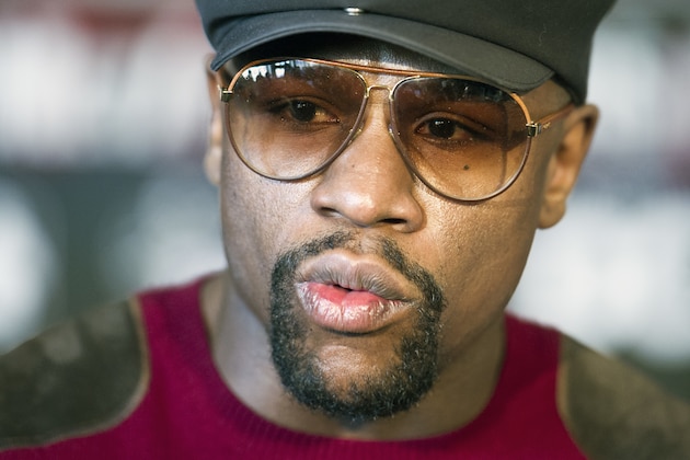 FILE - In this Feb. 29, 2016, file photo, five-division world champion boxer Floyd Mayweather talks in Washington about the upcoming world title fight between four-division world champion Adrien