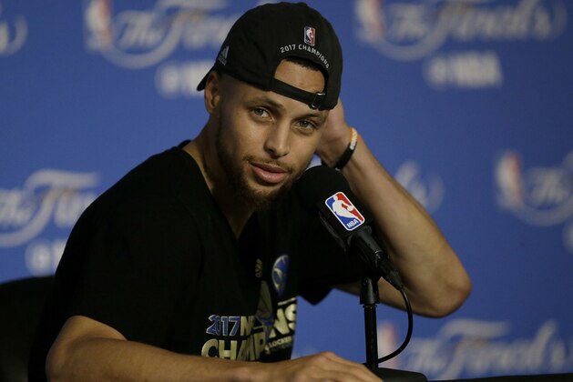 Golden State Warriors guard Stephen Curry speaks at a news conference after Game 5 of basketball's NBA Finals between the Warriors and the Cleveland Cavaliers in Oakland, Calif., Monday, June 12, 2017. The Warriors won 129-120 to win the NBA championship. (AP Photo/Ben Margot)