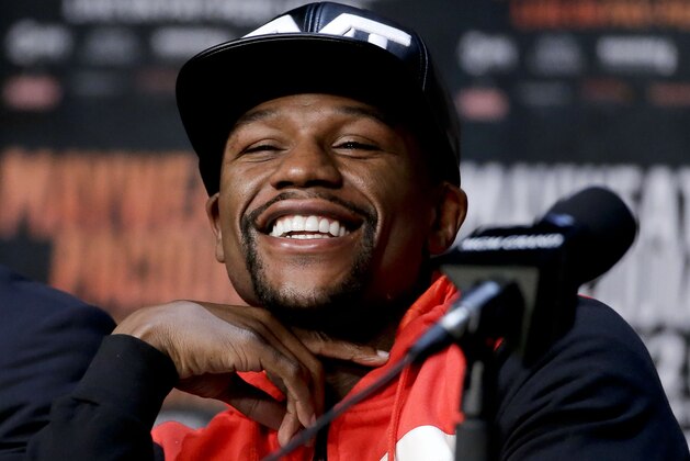 FILE - In this April 29, 2015, file photo, boxer Floyd Mayweather Jr. smiles during a pre-fight news conference in Las Vegas. Mayweather is being inducted into the Southern Nevada Sports Hall of Fame in Las Vegas on Friday, June 2, 2017. (AP Photo/Chris Carlson, File)