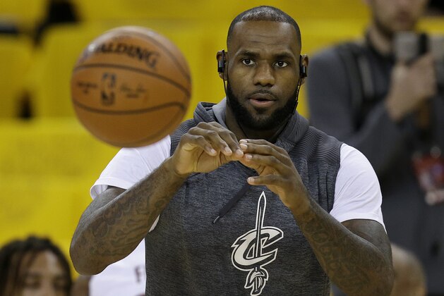 Cleveland Cavaliers forward LeBron James warms up before Game 5 of basketball's NBA Finals between the Golden State Warriors and the Cavaliers in Oakland, Calif., Monday, June 12, 2017. (AP Photo/Ben Margot)
