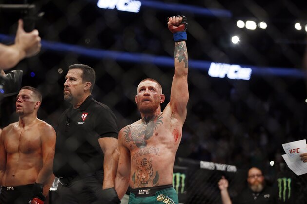 Conor McGregor fights Nate Diaz during their welterweight mixed martial arts bout at UFC 202 on Saturday, Aug. 20, 2016, in Las Vegas. McGregor won by split decision. (AP Photo/Isaac Brekken)