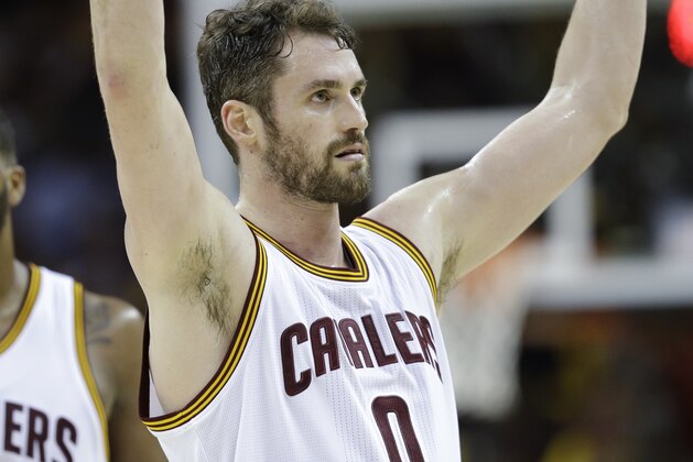 Cleveland Cavaliers' Kevin Love (0) jesters to the crowd during the second half of Game 4 of the NBA basketball Eastern Conference finals against the Boston Celtics, Tuesday, May 23, 2017, in Cleveland. The Cavaliers won 112-99. (AP Photo/Tony Dejak)