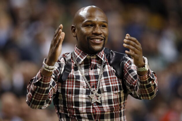 Jan 11, 2017; Boston, MA, USA;   Boxer Floyd Mayweather cheers on the Boston Celtics during the fourth quarter against the Washington Wizards at TD Garden.  The Boston Celtics won 117-108.  Mandatory Credit: Greg M. Cooper-USA TODAY Sports