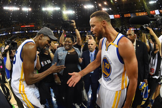 OAKLAND, CA - JUNE 12:  Kevin Durant #35 and Stephen Curry #30 of the Golden State Warriors celebrate after winning the 2017 NBA Finals on June 12, 2017 at ORACLE Arena in Oakland, California. NOTE TO USER: User expressly acknowledges and agrees that, by downloading and/or using this photograph, user is consenting to the terms and conditions of Getty Images License Agreement. Mandatory Copyright Notice: Copyright 2017 NBAE (Photo by Andrew D. Bernstein/NBAE via Getty Images)
