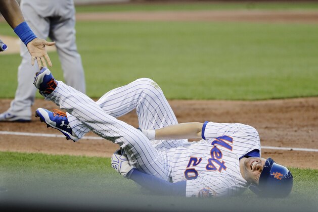 New York Mets' Neil Walker reacts after hurting his leg during the third inning of a baseball game against the Chicago Cubs on Wednesday, June 14, 2017, in New York. (AP Photo/Frank Franklin II) New York Mets' Neil Walker reacts after hurting his leg during the third inning of a baseball game against the Chicago Cubs on Wednesday, June 14, 2017, in New York. (AP Photo/Frank Franklin II)