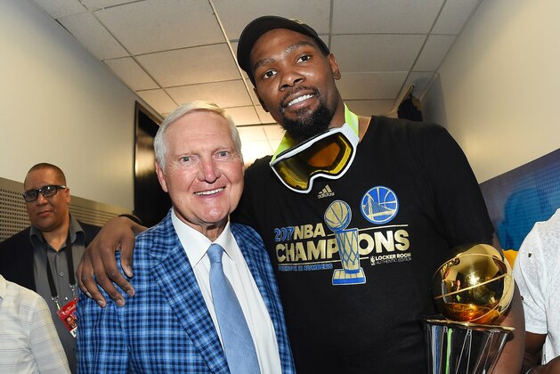OAKLAND, CA - JUNE 12:  NBA Finals MVP Kevin Durant #35 of the Golden State Warriors poses for a photo with NBA legend Jerry West after winning the NBA Championship in Game Five of the 2017 NBA Finals against the Cleveland Cavaliers on June 12, 2017 at ORACLE Arena in Oakland, California. NOTE TO USER: User expressly acknowledges and agrees that, by downloading and/or using this photograph, user is consenting to the terms and conditions of Getty Images License Agreement. Mandatory Copyright Notice: Copyright 2017 NBAE (Photo by Andrew D. Bernstein/NBAE via Getty Images)