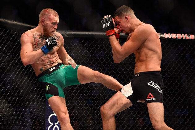 LAS VEGAS, NV - AUGUST 20:  (L-R) Conor McGregor of Ireland kicks Nate Diaz in their welterweight bout during the UFC 202 event at T-Mobile Arena on August 20, 2016 in Las Vegas, Nevada. (Photo by Jeff Bottari/Zuffa LLC/Zuffa LLC via Getty Images)