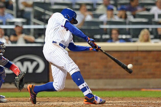 Jun 14, 2017; New York City, NY, USA; New York Mets center fielder Curtis Granderson (3) hits a solo home run against the Chicago Cubs during the eighth inning at Citi Field. Mandatory Credit: Brad Penner-USA TODAY Sports