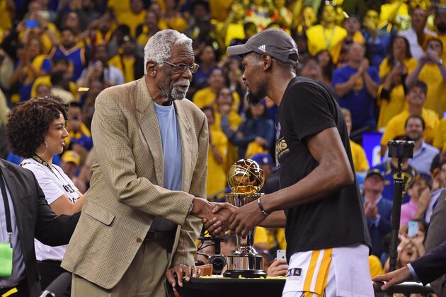 OAKLAND, CA - JUNE 12:  NBA Legend, Bill Russell shakes hands with Kevin Durant #35 of the Golden State Warriors on stage after winning Game Five of the 2017 NBA Finals against the Cleveland Cavaliers on June 12, 2017 at Oracle Arena in Oakland, California. NOTE TO USER: User expressly acknowledges and agrees that, by downloading and or using this photograph, user is consenting to the terms and conditions of Getty Images License Agreement. Mandatory Copyright Notice: Copyright 2017 NBAE (Photo by Adam Pantozzi/NBAE via Getty Images)
