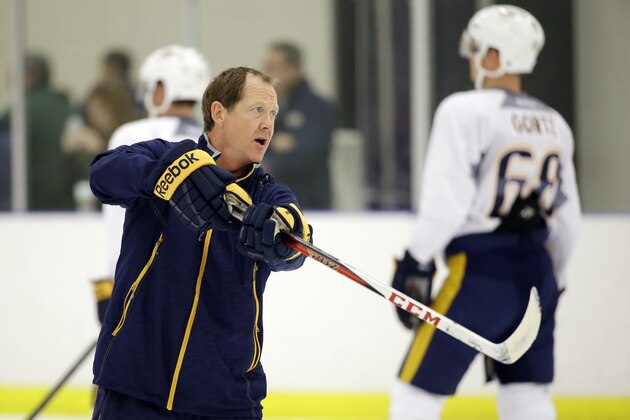 Nashville Predators assistant coach Phil Housley instructs players at NHL hockey training camp Friday, Sept. 18, 2015, in Nashville, Tenn. (AP Photo/Mark Humphrey)