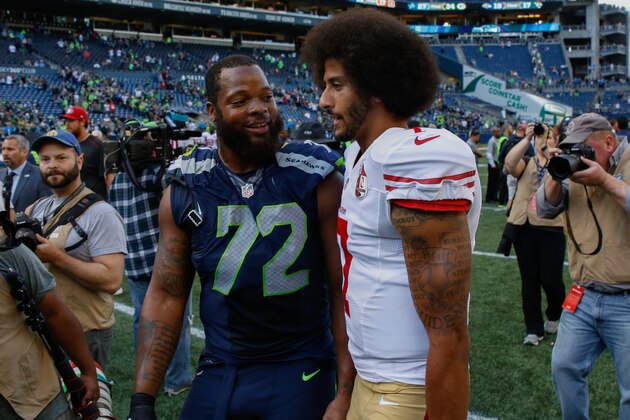 SEATTLE, WA - SEPTEMBER 25:  Quarterback Colin Kaepernick #7 of the San Francisco 49ers talks with defensive end Michael Bennett #72 of the Seattle Seahawks after the game at CenturyLink Field on September 25, 2016 in Seattle, Washington.  (Photo by Otto Greule Jr/Getty Images)