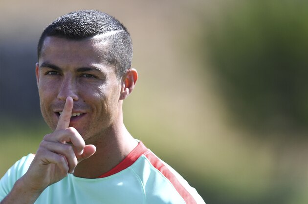 Portugal's forward Cristiano Ronaldo gestures during a training session at 'Cidade do Futebol' training camp in Oeiras, outskirts of Lisbon, on June 14, 2017 ahead of the 2017 FIFA Confederations Cup football tournament in Russia which begins on June 17. / AFP PHOTO / PATRICIA DE MELO MOREIRA        (Photo credit should read PATRICIA DE MELO MOREIRA/AFP/Getty Images)