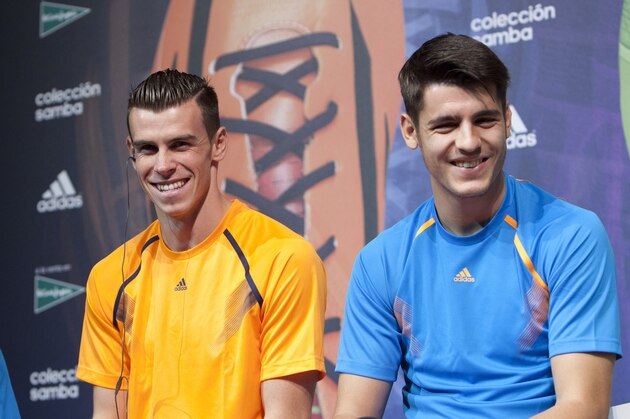 Real Madrid's Marcelo, left, Gareth Bale, center and Alvaro Morata during an event to check a new soccer cleats in Madrid, Spain. Thursday Nov. 21, 2013. (AP Photo/Abraham Caro Marin)