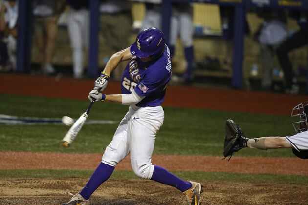 LSU's Antoine Duplantis (20) hits an RBI double in the ninth inning of an NCAA college baseball tournament super regional game against Mississippi State in Baton Rouge, La., Monday, June 12, 2017. LSU won 14-4 to advance to the College World Series. (AP Photo/Gerald Herbert)