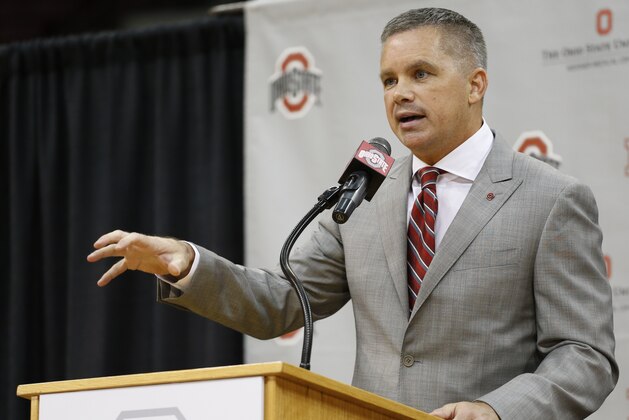 FILE - In this Monday, June 12, 2017, file photo, Chris Holtmann answers questions during a NCAA college basketball news conference introducing him the new men's head basketball coach at Ohio State in Columbus, Ohio. Holtmann's $3 million annual contract includes incentives for making the NCAA Tournament and ensuring his players get good grades. The contract still has to be approved by university trustees, but Ohio State released the terms Wednesday, June 14, 2017.  (AP Photo/Jay LaPrete, File)