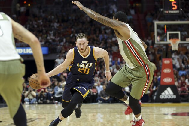 Utah Jazz's Gordon Hayward (20) drives to the basket as Miami Heat's James Johnson defends during the first half of an NBA basketball game, Saturday, Nov. 12, 2016, in Miami. (AP Photo/Lynne Sladky)