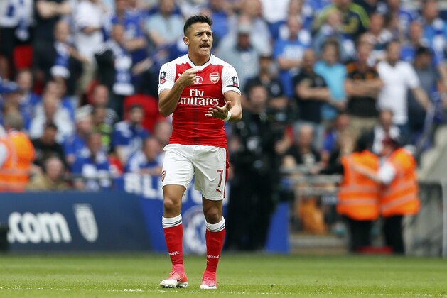 Arsenal's Alexis Sanchez gestures after scoring the opening goal during the English FA Cup final soccer match between Arsenal and Chelsea at Wembley stadium in London, Saturday, May 27, 2017. (AP Photo/Kirsty Wigglesworth)