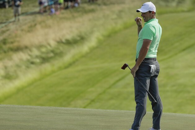 Rory Mcilroy, of Ireland, reacts to a putt on the eighth hole during the first round of the U.S. Open golf tournament Thursday, June 15, 2017, at Erin Hills in Erin, Wis. (AP Photo/Charlie Riedel)