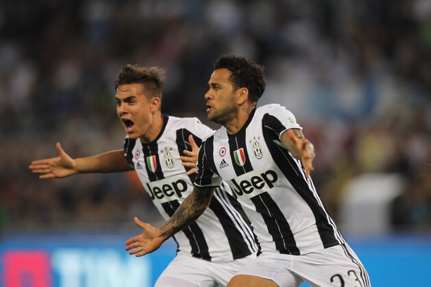 ROME, ITALY - MAY 17:  Dani Alves and Paulo Dybala of Juventus FC celebrates after scoring the opening goal during the TIM Cup Final match between SS Lazio and Juventus FC at Olimpico Stadium on May 17, 2017 in Rome, Italy.  (Photo by Paolo Bruno/Getty Images)