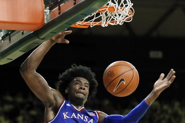 FILE - In this Feb. 18, 2017, file photo, Kansas guard Josh Jackson (11) dunks against Baylor in the first half of an NCAA college basketball game, in Waco, Texas. Kansas freshman Josh Jackson has announced he will enter the NBA draft. Jackson, who released a statement on Monday, April 17, 2017, was the Big 12 Newcomer of the Year after averaging 16.3 points and 7.4 rebounds per game.(AP Photo/Tony Gutierrez, File)
