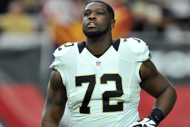 New Orleans Saints tackle (72) Terron Armstead heads for the sidelines before the start of a game the Arizona Cardinals defeated the Saints 31 to 19 in a game played at University of Phoenix Stadium in Glendale, Ariz. on Sunday, Sept. 13, 2015. (AP Photo/John Cordes)