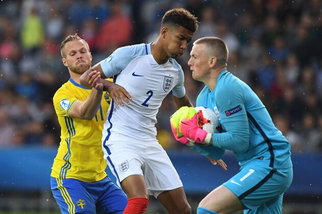 Sweden's Gustav Engvall (L) vies with England's Mason Holgate as England's goalkeeper Jordan Picford (R) grabs the ball during an UEFA U21 European Championship Group A football match between Sweden and England in Kielce on June 16, 2017. / AFP PHOTO / PIOTR NOWAK (Photo credit should read PIOTR NOWAK/AFP/Getty Images) Sweden's Gustav Engvall (L) vies with England's Mason Holgate as England's goalkeeper Jordan Picford (R) grabs the ball during an UEFA U21 European Championship Group A football match between Sweden and England in Kielce on June 16, 2017. / AFP PHOTO / PIOTR NOWAK (Photo credit should read PIOTR NOWAK/AFP/Getty Images)
