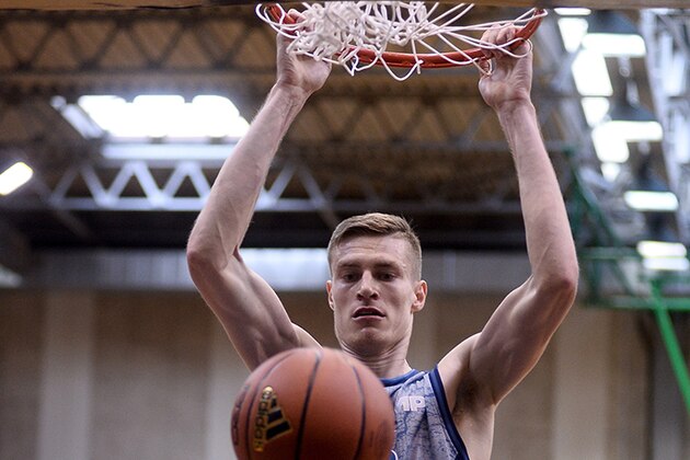 Michael Fusek finishes a dunk at Adidas Eurocamp.