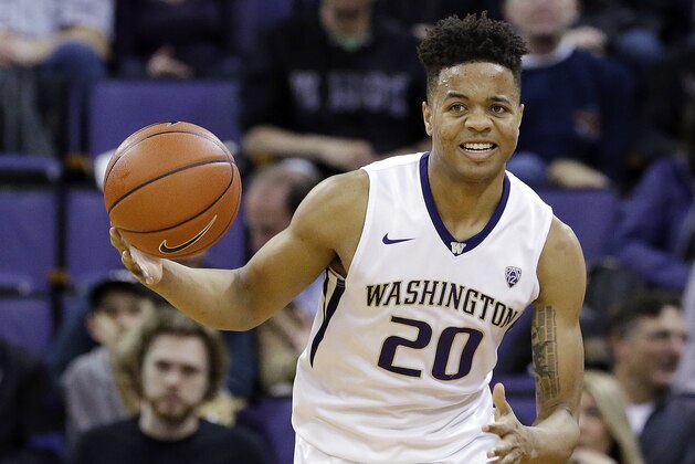 FILE - In this Feb. 18, 2017, file photo, Washington's Markelle Fultz brings the ball upcourt against Arizona during an NCAA college basketball game in Seattle. Fultz was selected to the AP All-Pac-12 Conference first team, Tuesday, March 7, 2017. (AP Photo/Elaine Thompson, File)