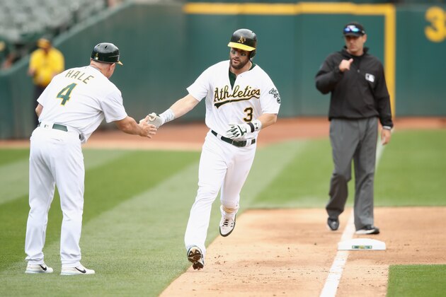 OAKLAND, CA - JUNE 07:  Trevor Plouffe #3 of the Oakland Athletics is congratulated by third base coach Chip Hale after he hit a home run in the fourth inning against the Toronto Blue Jays at Oakland Alameda Coliseum on June 7, 2017 in Oakland, California.  (Photo by Ezra Shaw/Getty Images)