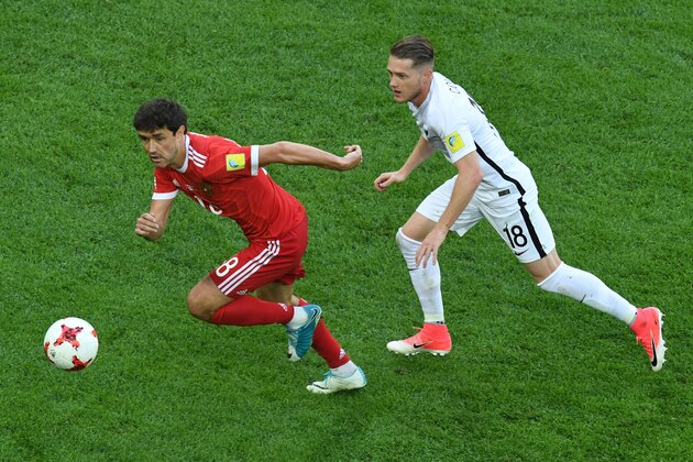 Russia's midfielder Yury Zhirkov (L) fights for theball against New Zealand's defender Kip Colvey vduring the 2017 Confederations Cup group A football match between Russia and New Zealand at the Krestovsky Stadium in Saint-Petersburg on June 17, 2017. / AFP PHOTO / FRANCOIS XAVIER MARIT        (Photo credit should read FRANCOIS XAVIER MARIT/AFP/Getty Images)