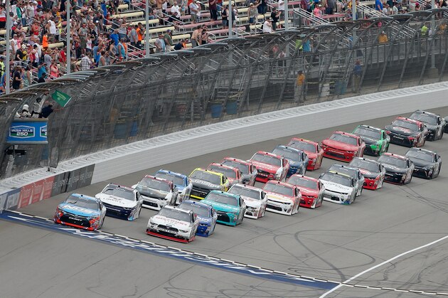 BROOKLYN, MI - JUNE 17:  Kyle Busch, driver of the #18 NOS Energy Drink Toyota, and Brad Keselowski, driver of the #22 Discount Tire Ford, lead the field to green for the start of the NASCAR XFINITY Series Irish Hills 250 at Michigan International Speedway on June 17, 2017 in Brooklyn, Michigan.  (Photo by Brian Lawdermilk/Getty Images)