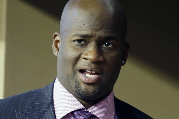 FILE - In this Sept. 13, 2014, file photo, Vince Young is shown in a suite during a college football game in Arlington, Texas. Vince Young still isn't quite ready to call it a career. The two-time Pro Bowl quarterback has hired agent Leigh Steinberg, who welcomed his new client on Twitter on Wednesday, Feb. 15, 2017, and said Young