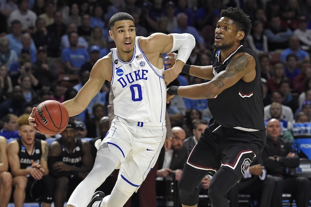 Duke's Jayson Tatum, left, drives past South Carolina's Chris Silva, right, during the first half in a second-round game of the NCAA men's college basketball tournament in Greenville, S.C., Sunday, March 19, 2017. (AP Photo/Rainier Ehrhardt)