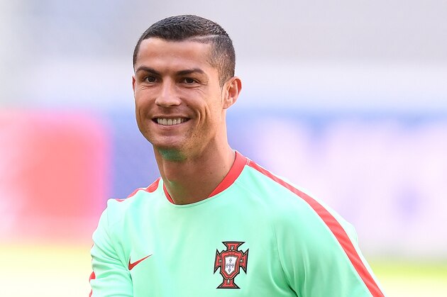 Portugal's forward Cristiano Ronaldo smiles during a training session at the Kazan Arena stadium in Kazan, Russia, on June 17, 2017 on the eve of the Russia 2017 Confederations Cup football match Portugal vs Mexico. / AFP PHOTO / FRANCK FIFE (Photo credit should read FRANCK FIFE/AFP/Getty Images) Portugal's forward Cristiano Ronaldo smiles during a training session at the Kazan Arena stadium in Kazan, Russia, on June 17, 2017 on the eve of the Russia 2017 Confederations Cup football match Portugal vs Mexico. / AFP PHOTO / FRANCK FIFE (Photo credit should read FRANCK FIFE/AFP/Getty Images)
