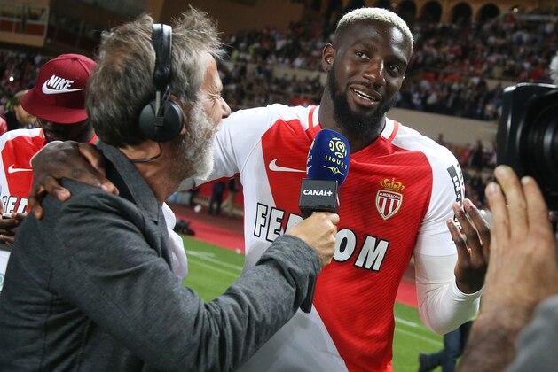 MONACO, MONACO - MAY 17: Tiemoue Bakayoko of Monaco is interviewed by Laurent Paganelli during the French League 1 Championship title celebration following the French Ligue 1 match between AS Monaco and AS Saint-Etienne (ASSE) at Stade Louis II on May 17, 2017 in Monaco, Monaco. (Photo by Jean Catuffe/Getty Images)
