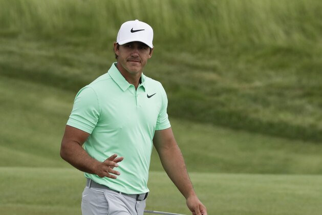 CORRECTS SPELLING OF LAST NAME TO KOEPKA, NOT KOPEKA - Brooks Koepka gestures after putting on the sixth hole during the fourth round of the U.S. Open golf tournament Sunday, June 18, 2017, at Erin Hills in Erin, Wis. (AP Photo/Chris Carlson)