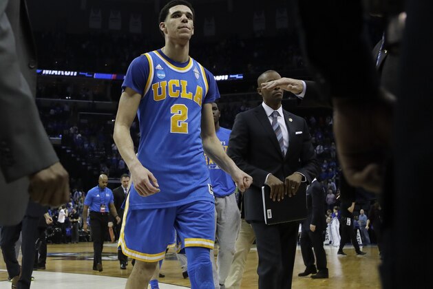 UCLA guard Lonzo Ball (2) leaves the court after UCLA lost to Kentucky in an NCAA college basketball tournament South Regional semifinal game Friday, March 24, 2017, in Memphis, Tenn. (AP Photo/Mark Humphrey)