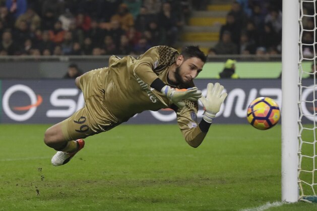 AC Milan goalkeeper Gianluigi Donnarumma saves during a Serie A soccer match between AC Milan and Inter Milan, at the San Siro stadium in Milan, Italy, Sunday, Nov. 20, 2016. (AP Photo/Luca Bruno)